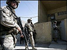 U.S. Marines and Iraqi soldiers patrol in Sadr City, a large Shiite district in Baghdad. Two U.S. soldiers were killed southeast of the capital yesterday.
