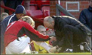 David Beckham receives treatment after picking up an injury during Man Utd's 2-0 FA Cup defeat by Arsenal on Saturday