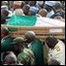The casket containing the body of late Nigerian President Umaru Yar'Adua is carried from the Katsina Stadium to the cemetery, in Katsina, northern Nigeria