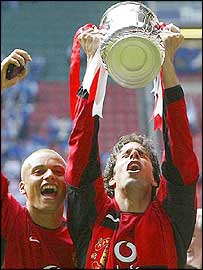 Double goal-scorer Ruud van Nistelrooy (right) celebrates with team-mate Wes Brown