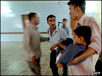A boy injured in the blast is carried into hospital