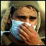 Saudi security officer in mask reacts as he sees bodies of pilgrims
