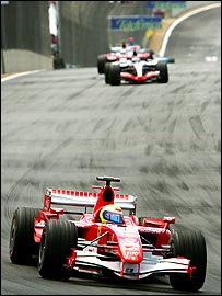 Felipe Massa ahead of Kimi Raikkonen and Jarno Trulli early in the Brazilian Grand Prix