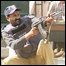 A Pakistani policeman fires at gunmenat a police academy in Manawan, near Lahore 
