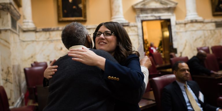Maryland state Sen. Sarah Elfreth hugs a colleague at an orientation in the Senate Chamber. (photo by Sarah L. Voisin/The Washington Post via Getty Images)