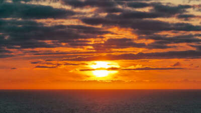 The sun sets over the Arctic Ocean near the North Cape on August 23, 2023, in Honningsvag, Norway.