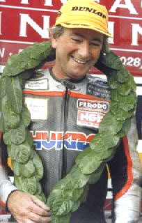 Photo of Dunlop on the TT podium wearing a wreath