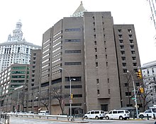 Photograph of the multi-story Metropolitan Correctional Center in New York