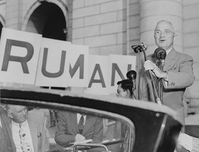 President Truman campaigning in an open car in October 1948