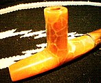 Uncompahgre Ute Salmon Alabaster Ceremonial Pipe. Ute pipe styles are similar to those of the Plains Indians, with notable differences. Ute pipes are thicker and use shorter pipestems than the Plains style, and more closely resemble the pipe styles of their Northern neighbors, the Shoshone.