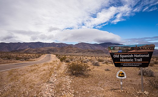 Modern sign marking the Old Spanish Historical Trail across Pahrump Valley on the California-Nevada border. South Nopah Range in background.
