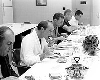 Several men at a sit-down breakfast