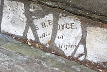Fragments of a headstone reading S R.BOYCE.
