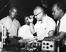 Julius Taylor, left, and Herman Branson of Howard University, right, with two unidentified colleagues in the lab. Photo taken at Morgan State University in the 1960s.