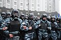 Defensive line of "Berkut" unitmen in riot gear by the Cabinet of Ministers building in Kyiv during 2013 Euromaidan protests.