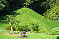 Two hills covered with trimmed bamboo grass which represent Mount Lu in China. This feature is in Koishikawa Kōrakuen Garden in Tokyo.
