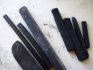 Sticks of vine charcoal and compressed charcoal. Charcoal, along with red and yellow ochre, was one of the first pigments used by Paleolithic man.