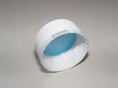 Plastic bottle screw cap used to seal a plastic bottle.