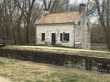 old building near a canal lock