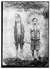 An Ifugao bridal pair (c. 1910). A newly-woven loincloth is part of the kango headdress of the man.