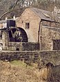 A mid-nineteenth century water wheel for a mill grinding locally mined barytes . It is no longer used for any purpose but can be seen turning on occasion.