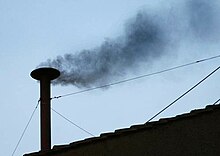 Black smoke coming from the Sistine Chapel chimney before the election of Pope Benedict XVI