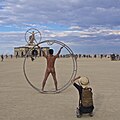 Image 17Naked participant at Burning Man 2016 posing as Leonardo da Vinci's Vitruvian Man (from Naturism)