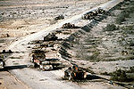 Iraqi armored personnel carriers, tanks and trucks destroyed in a Coalition attack along a road in the Euphrates River Valley during Operation Desert Storm, in 1991