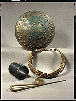 Bronze and gold votive items.