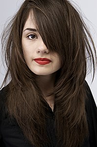 Brunette is the French term for a woman with brown (brun) hair