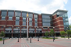 A low but large 5-story brick and glass building, with the letters "Jacksonville Veterans Memorial Arena" mounted above the entrance.