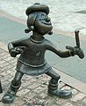 Image 30Statue of Minnie the Minx, a character from The Beano. Launched in 1938, the comic is known for its anarchic humour, with Dennis the Menace appearing on the cover. (from Children's literature)