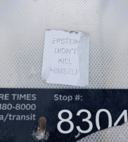 A simple white sticker reading, "Epstein Didn't Kill Himself."