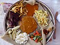 Misir Wot Misir Wot is a Lentil stew, served with a variety of vegetables, there are several variations. This example is served potatoes, beets, apple, salad, paprika and rice atop of injera. A popular vegan dish.