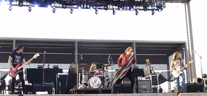 We Are Harlot performing live in 2015. From left to right: Brian Weaver, Bruno Agra, Danny Worsnop and Jeff George.