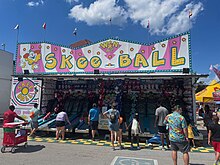 People playing skee-ball at the Indiana State Fair