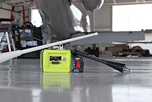 An aircrafts Emergency Locator Transmitter or ELT in the airport hangar
