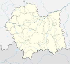 Mapa konturowa województwa małopolskiego, blisko centrum na prawo znajduje się punkt z opisem „Zbyszyce”