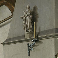 Detail of the sculpture of the Trinity shown above the fireplace in the right panel