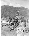 Gun crew of a 105mm howitzer in action along the 1st Cavalry Division sector.