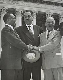 Hayes, Marshall, and Nabit, smiling, stand outside the Supreme Court, with the inscription "Equal Justice Under Law" visible overhead