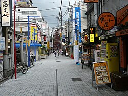 Ekinishiguchi Street in Uchi-Kanda, looking east. On the left is the Satake Inari Shrine.