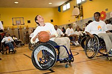 Students play wheelchair basketball