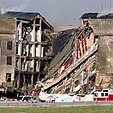 A portion of the Pentagon charred and collapsed, exposing the building's interior