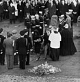 Jacqueline Kennedy and Attorney General Robert F. Kennedy walk away from President Kennedy's casket during interment at Arlington National Cemetery on November 25, 1963.