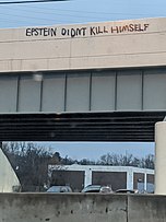 Graffito on a bridge over a highway