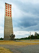 A memorial at Sachsenhausen decorated with red triangles