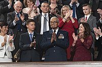 Brigadier General Charles McGee being honored by President Donald Trump at the 2020 State of the Union Address, with his great-grandson Iain Lanphier to the left and Second Lady Karen Pence to the right