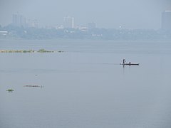 Two man sailing on the Congo river with his canoe.jpg
