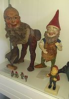 Historical gnomes in a museum display at the Gnome Reserve in Devon UK